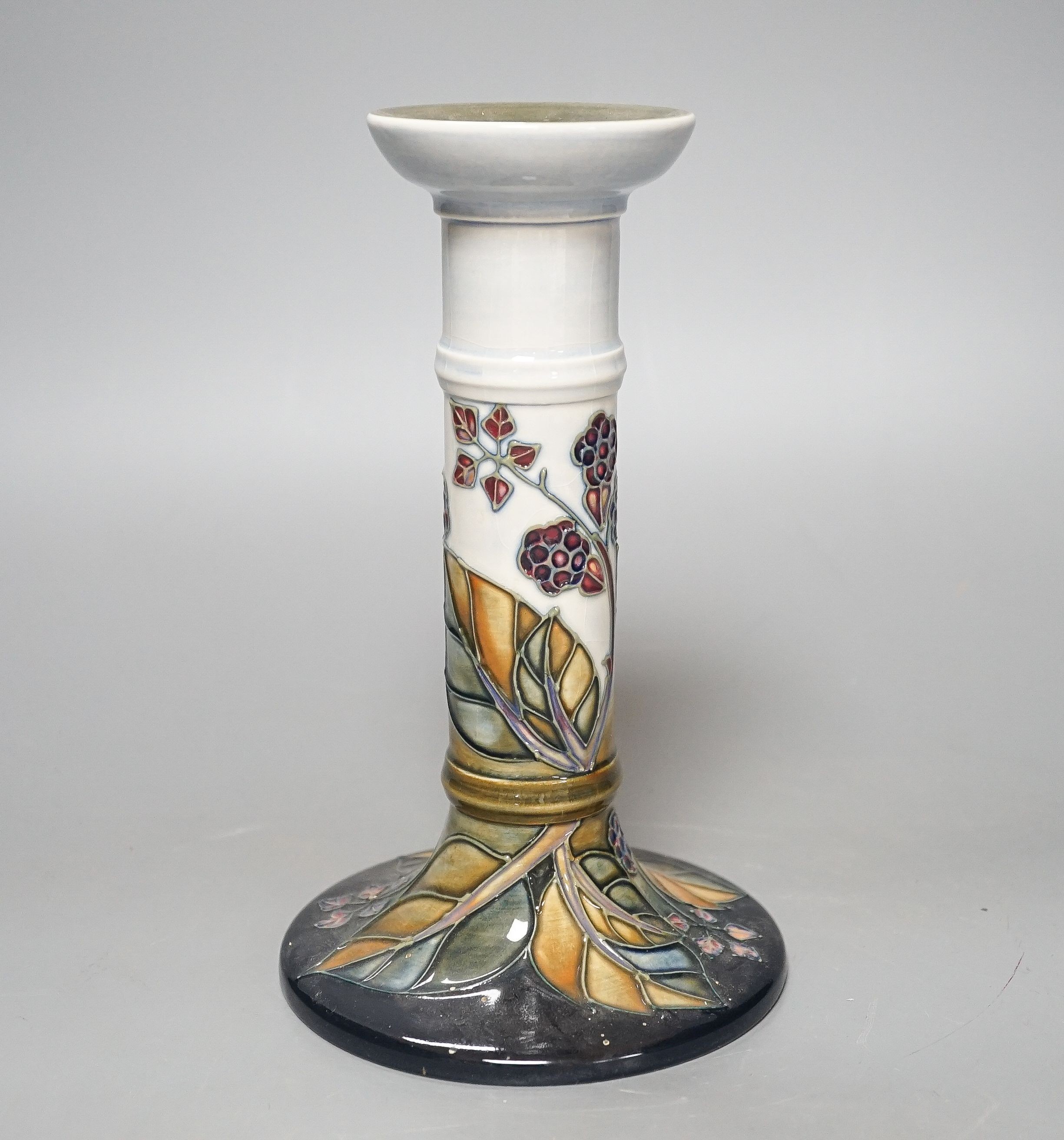 A Moorcroft bramble pattern candlestick 21cm